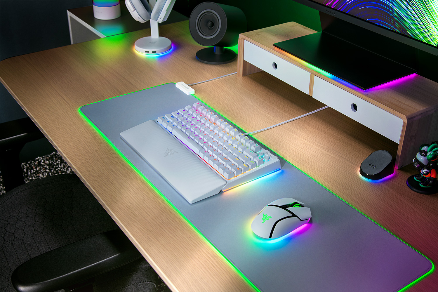 White Razer BlackWidow V4 75 percent keyboard in an RGB gaming desk setup